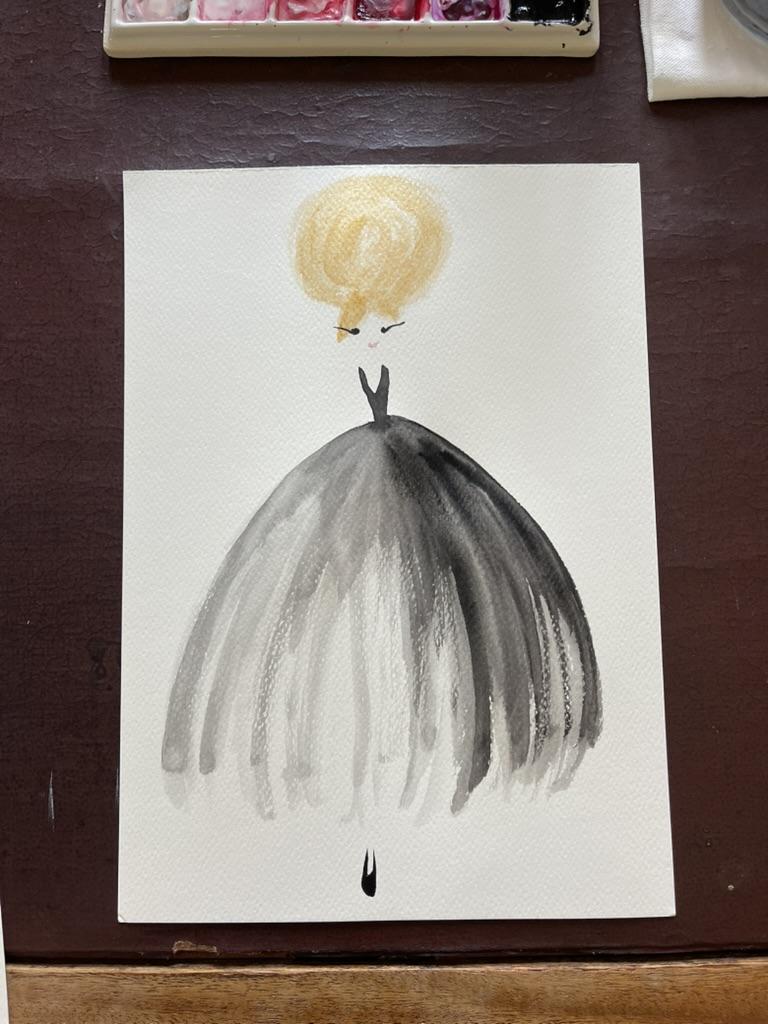 Artistic depiction of a black umbrella with a yellow ball on top, placed on a brown surface.