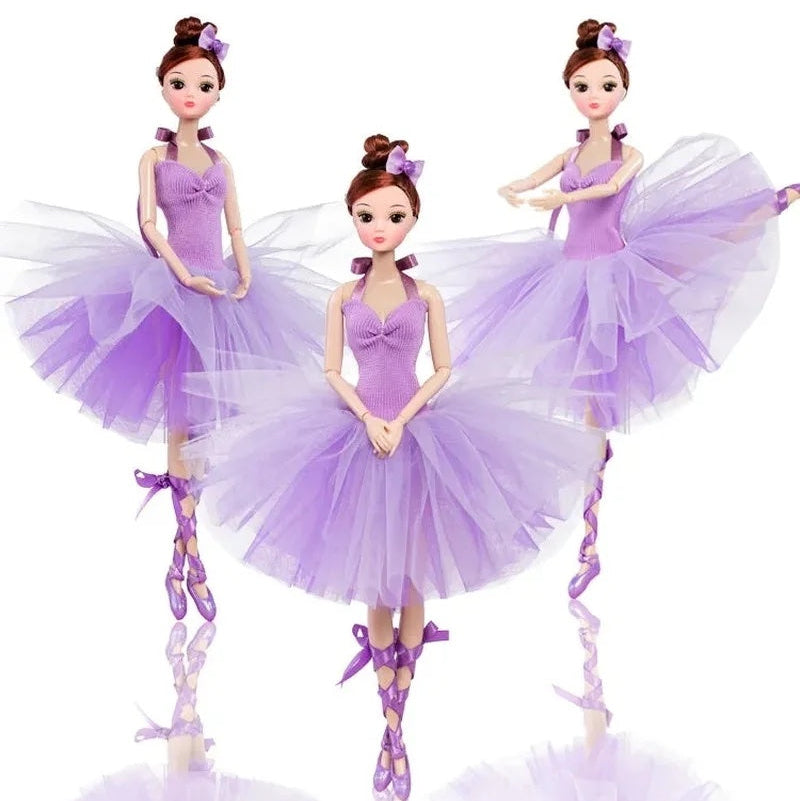 Three dolls in purple ballet outfits on a white background