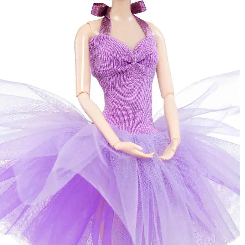 Mannequin wearing a purple dress with a bow at the neck on a white background