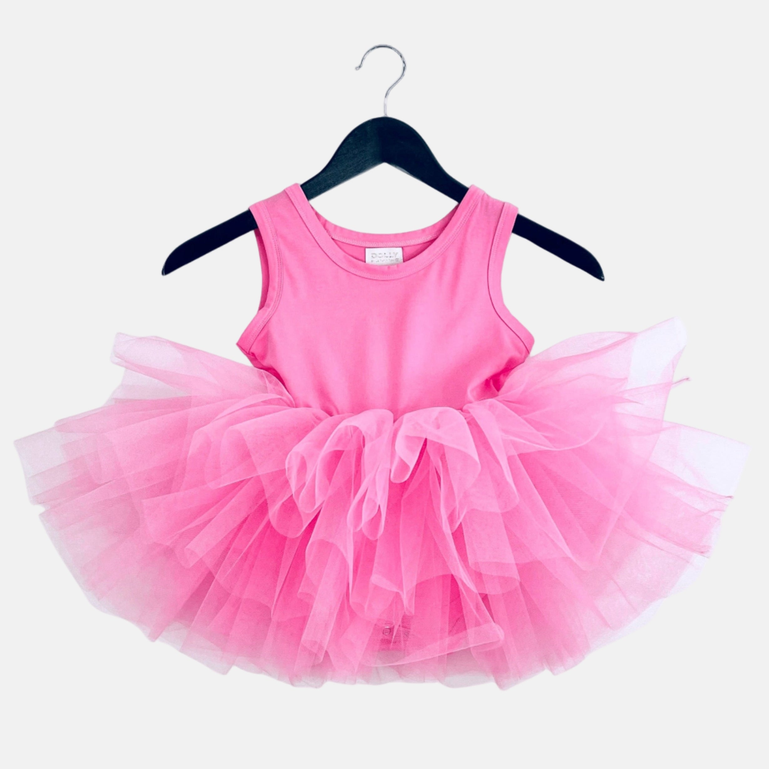 Pink tutu dress on a hanger against a white background