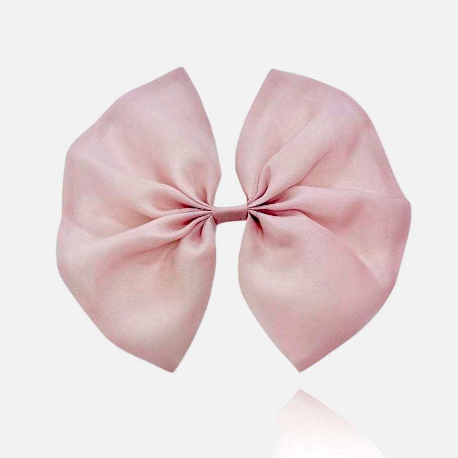 A large organza hair bow in mauve color with a clip attached, designed to be worn in the hair or on clothing.