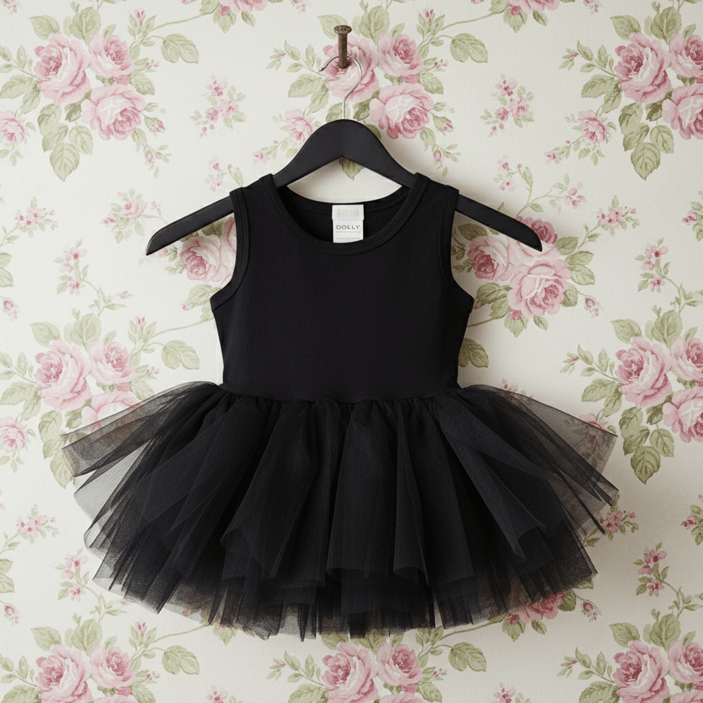 Black tutu dress on a hanger against a floral wallpaper background