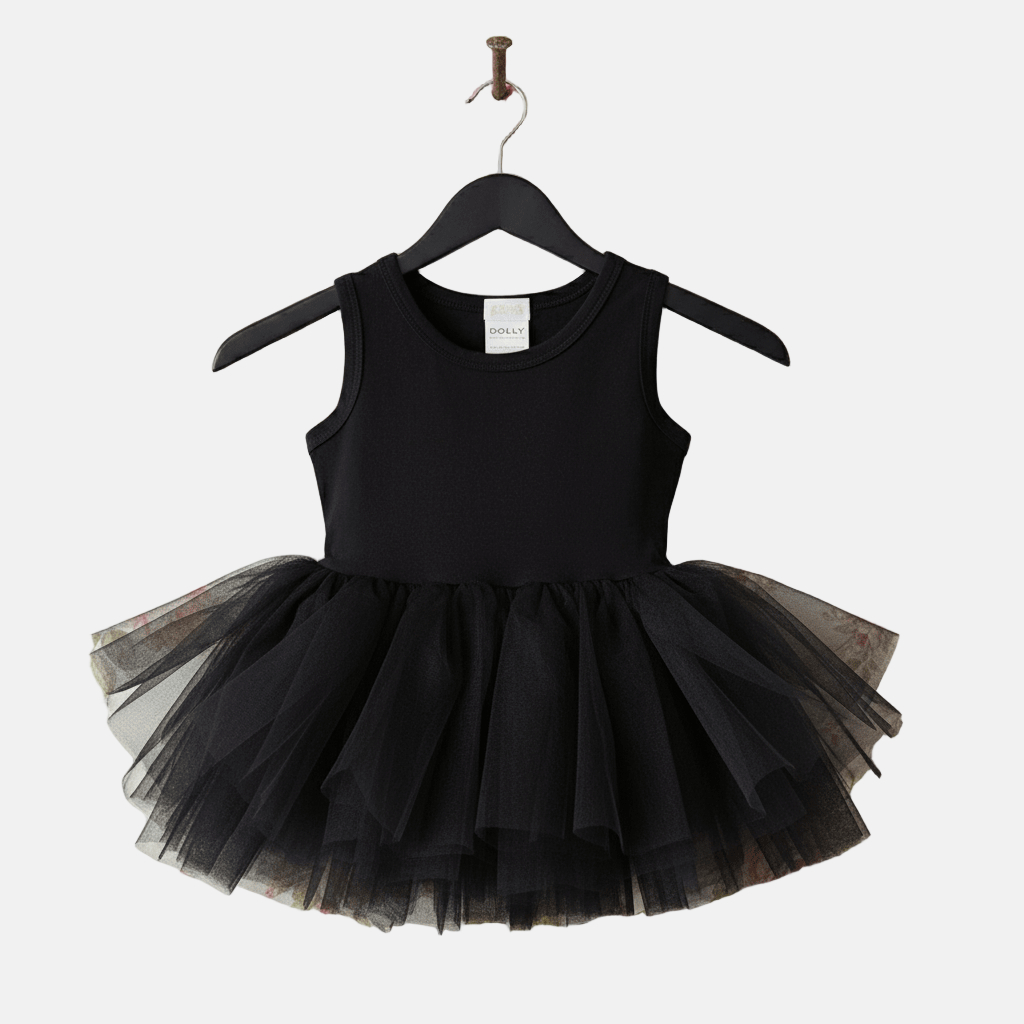Black tutu dress on a hanger against a white background