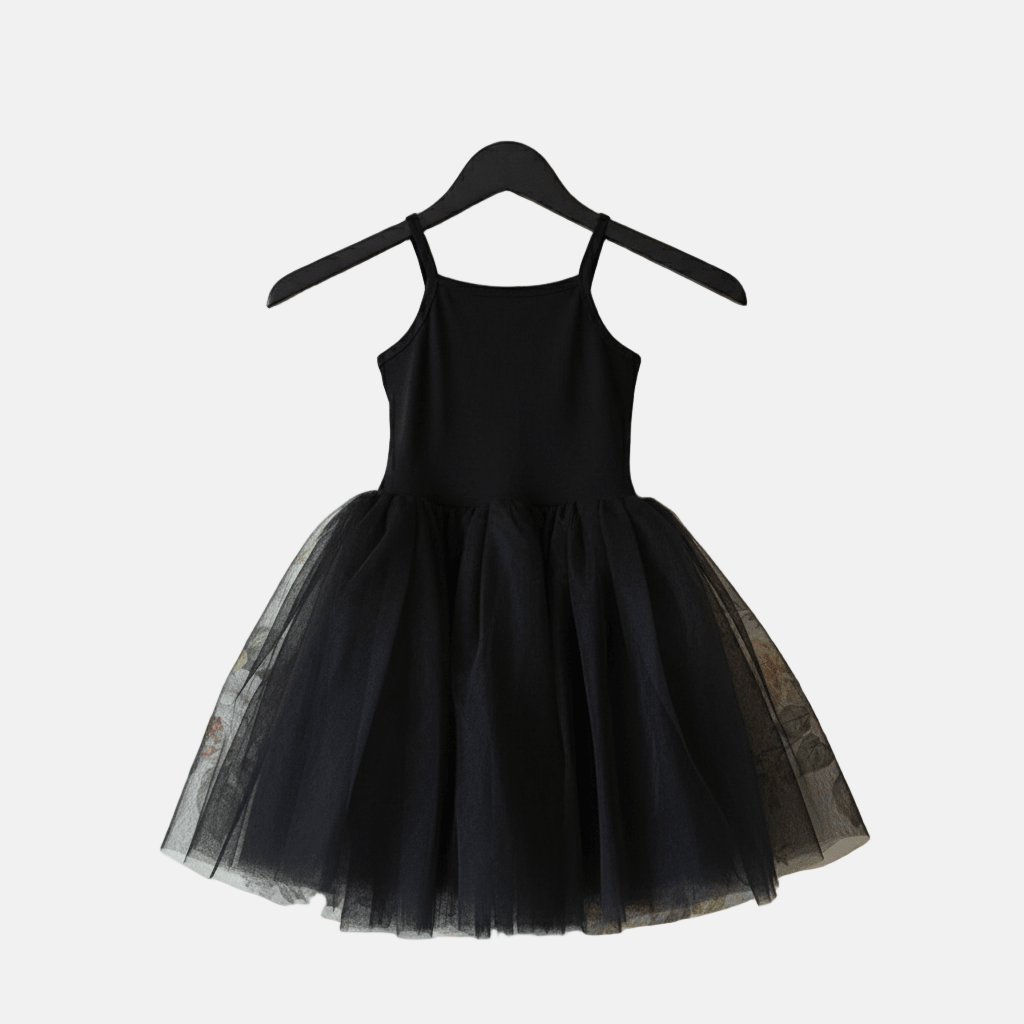 Black dress with tulle skirt on a hanger against a white background