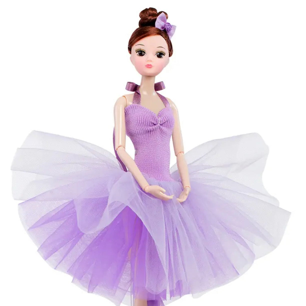 Doll wearing a purple dress with a white skirt on a white background