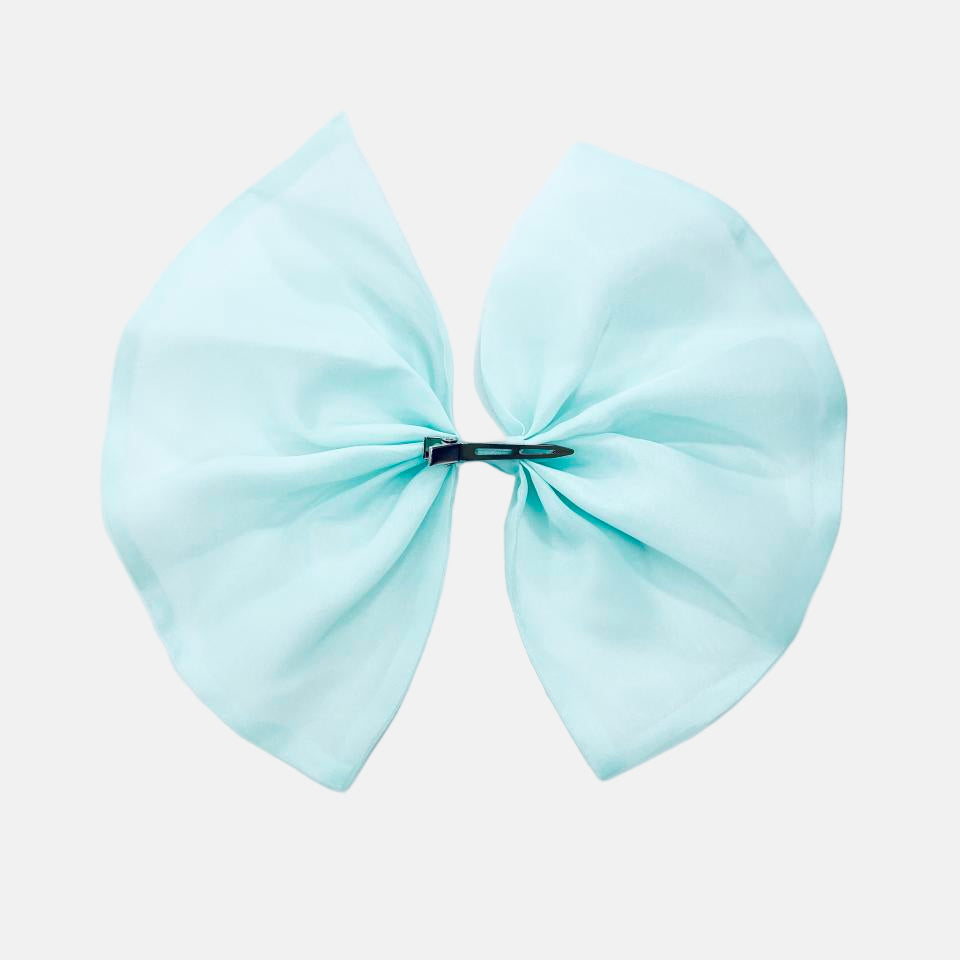 Light blue hair bow on a white background
