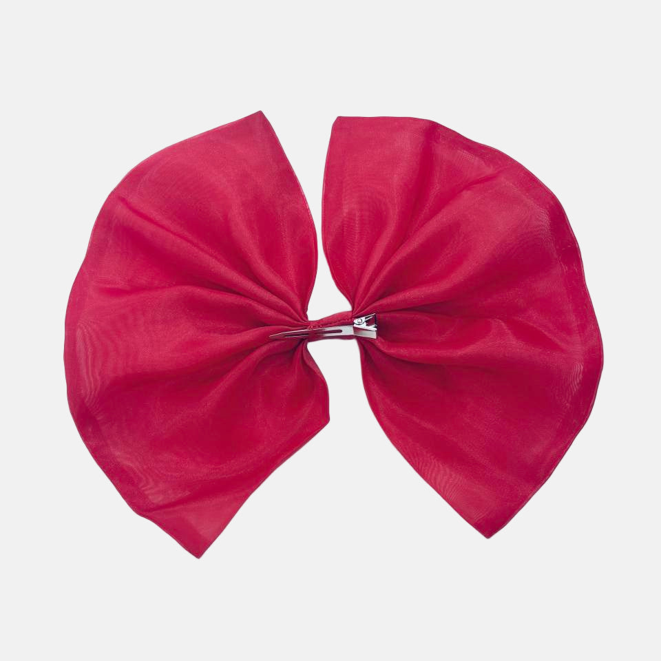 Red bow on a light gray background
