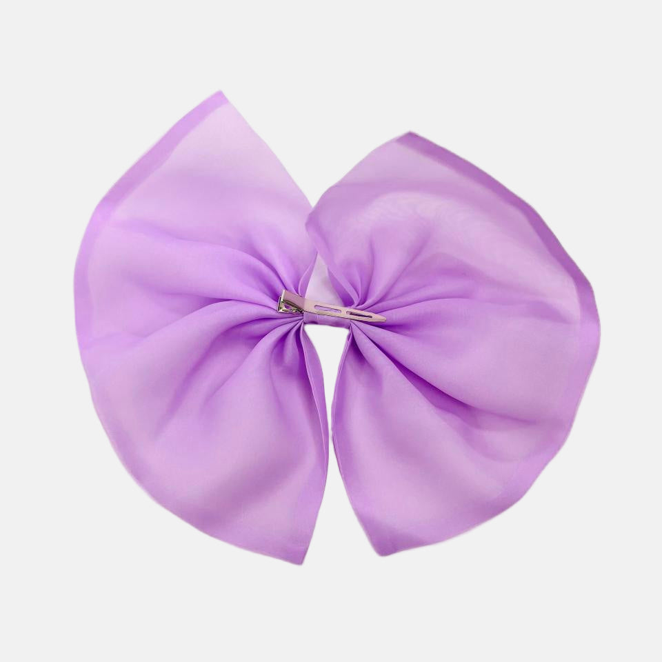 Large purple bow from DOLLY Le Petit Tom® on a light gray background
