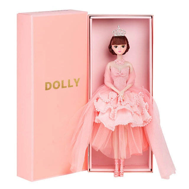 A DOLLY® Princess Doll with a pink tutu dress, presented in a pink ballet slipper-shaped gift box with the DOLLY® logo.