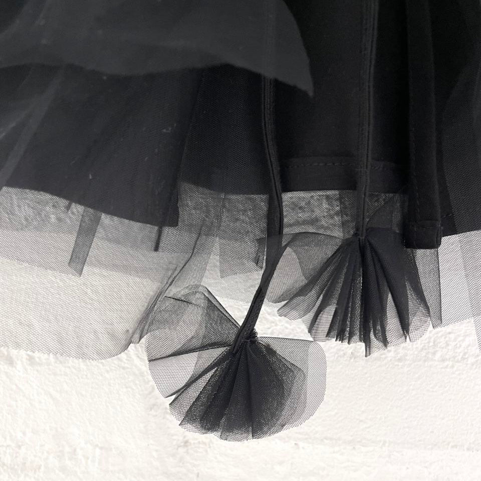 Black tulle skirt with a blurred background