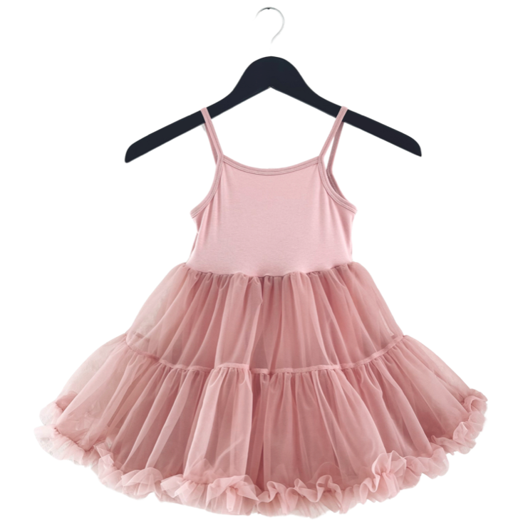 Pink dress with a layered skirt on a hanger against a white background