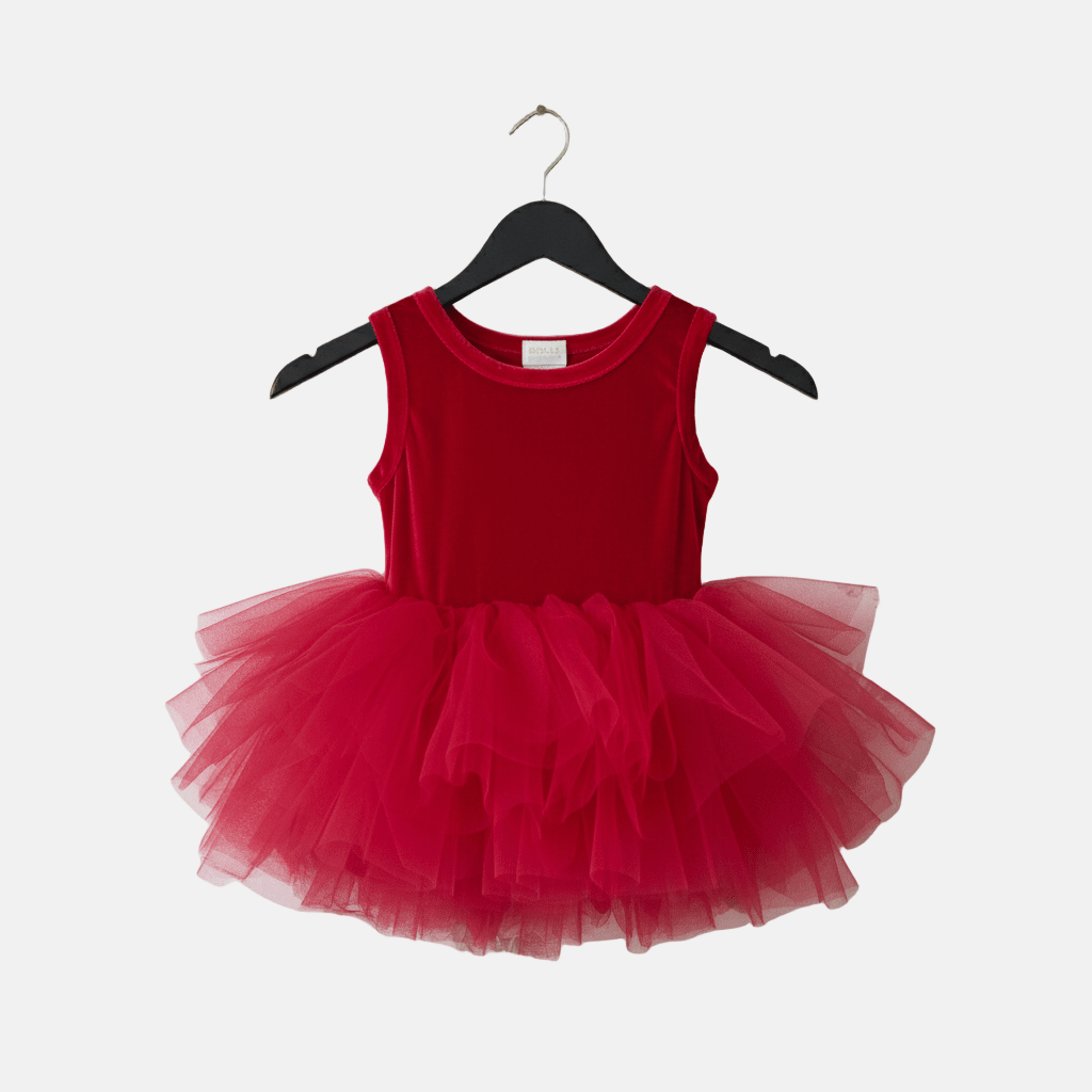 Red tutu dress on a hanger against a white background