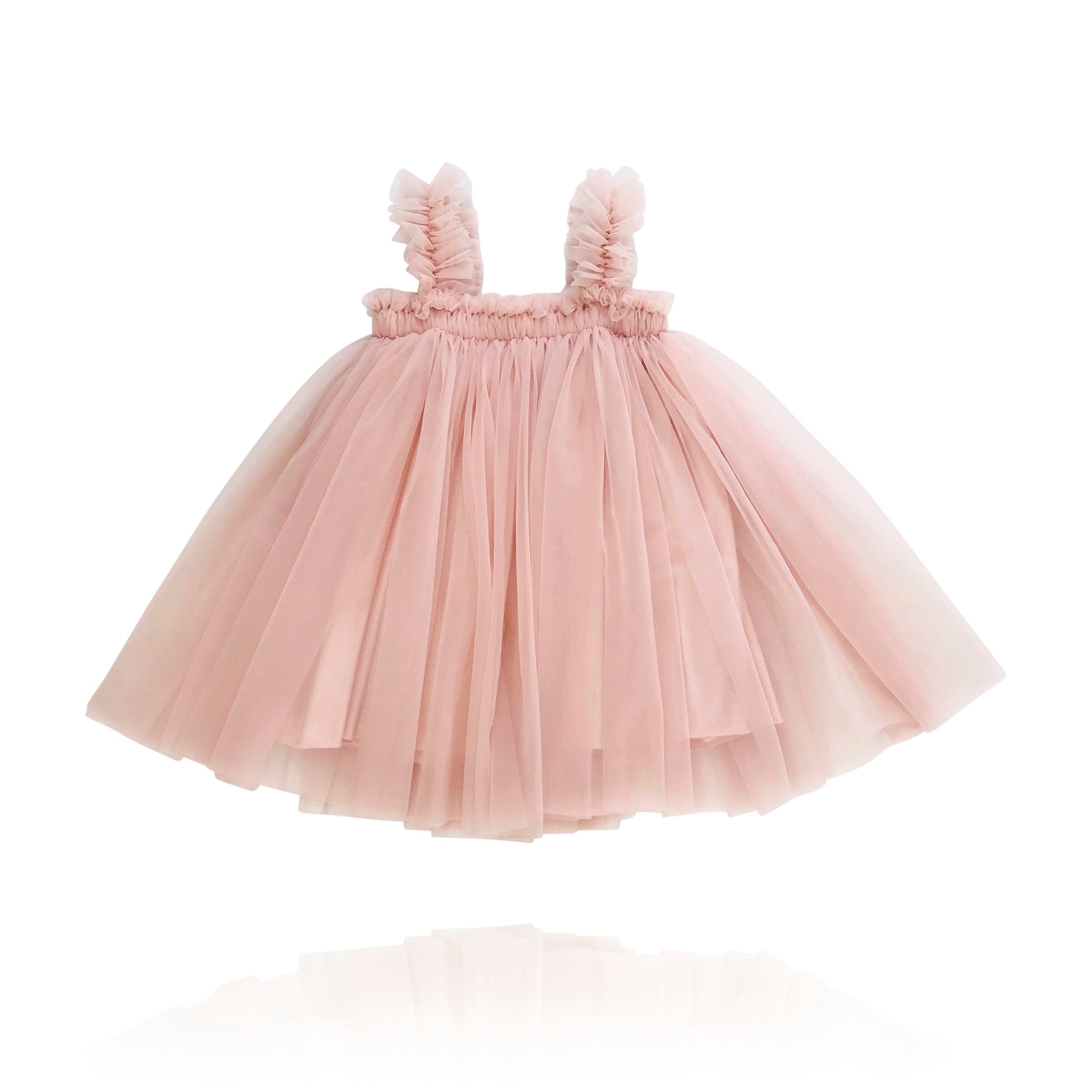 A ballet pink tutu dress with ruffled shoulder straps and an A-line silhouette, made of nylon chiffon.