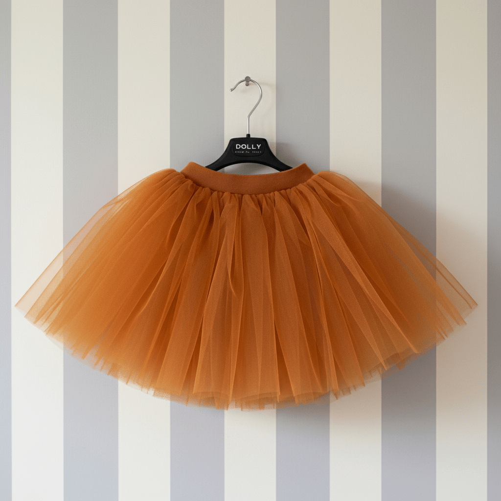 Brown tulle skirt on a hanger against a striped wall.