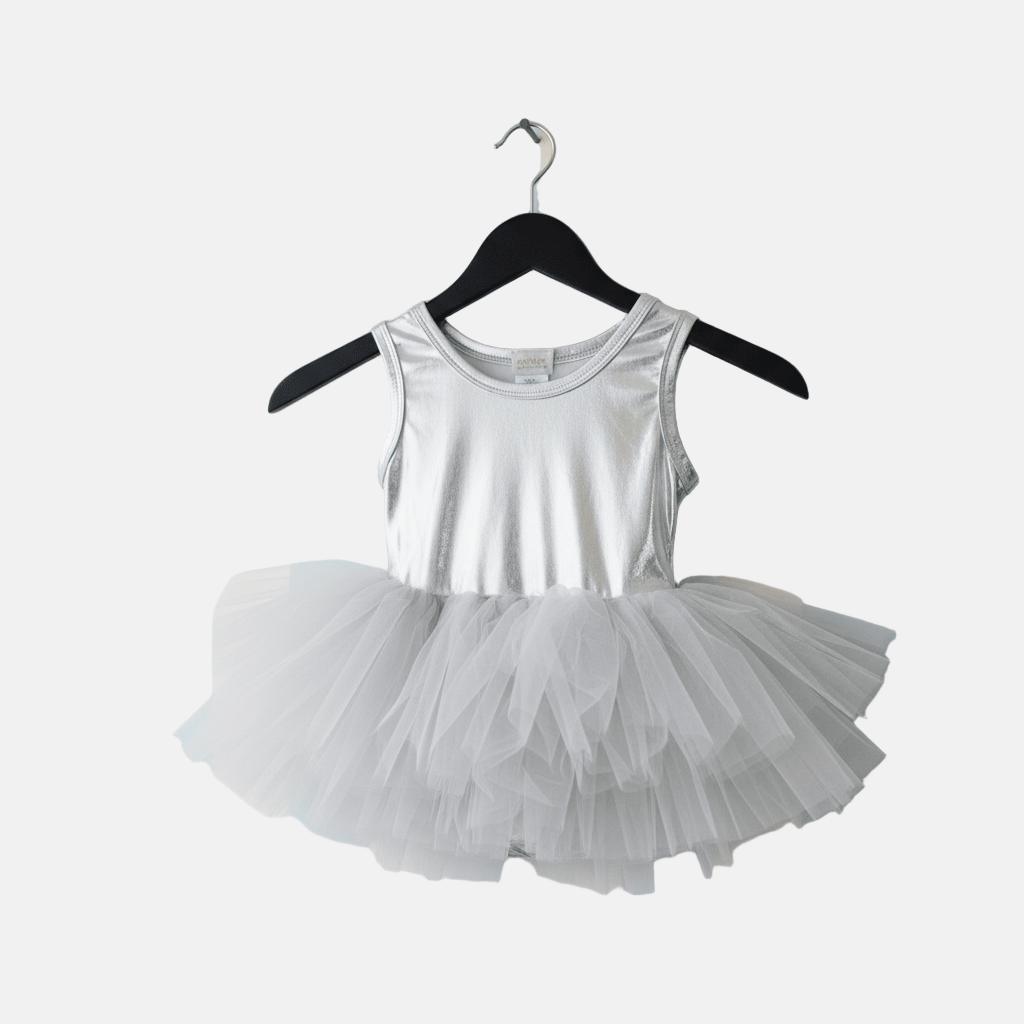 White tank top with a tutu skirt on a hanger against a white background