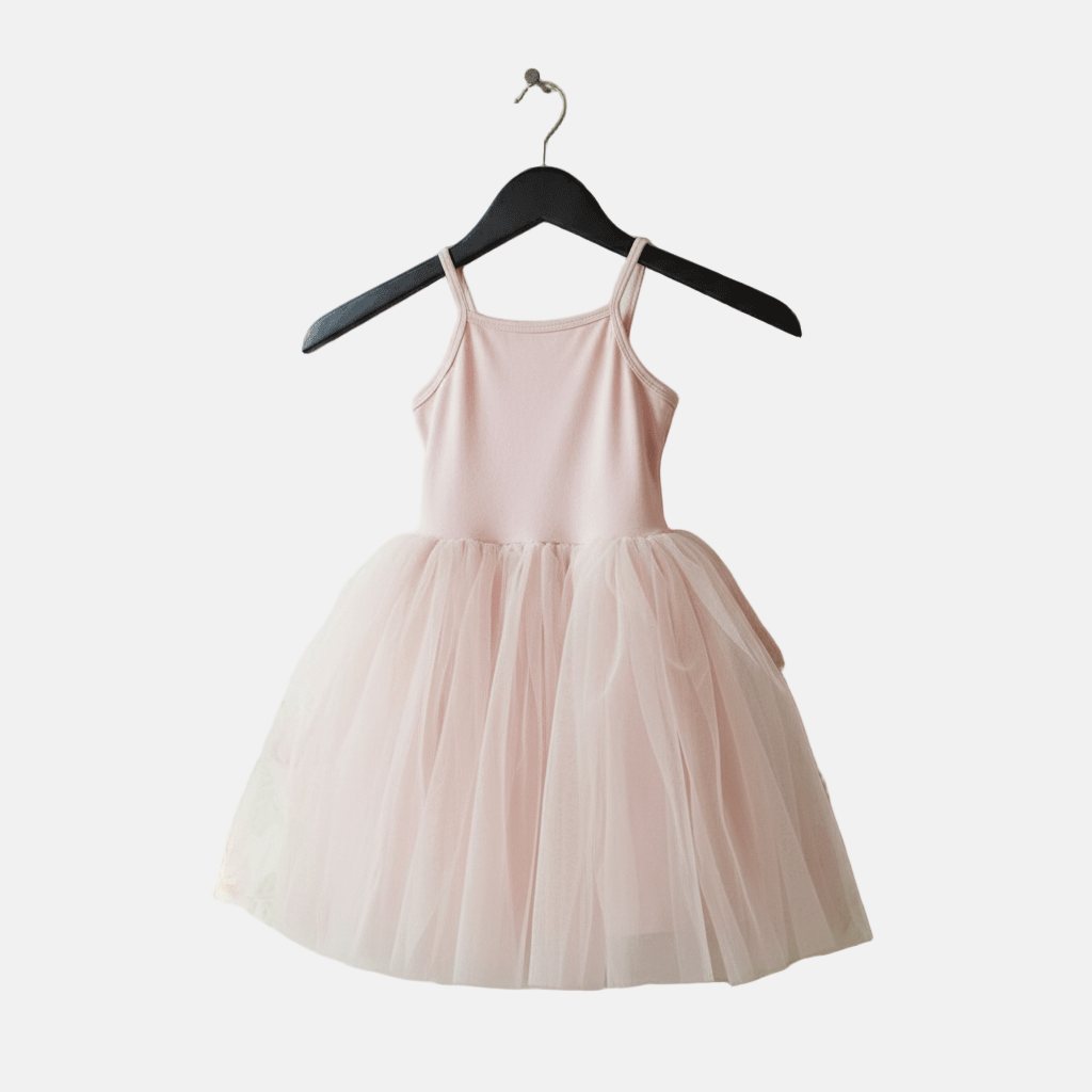 Pink dress on a hanger against a white background