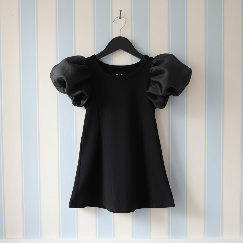 Black dress with puff sleeves on a hanger against a striped wall.
