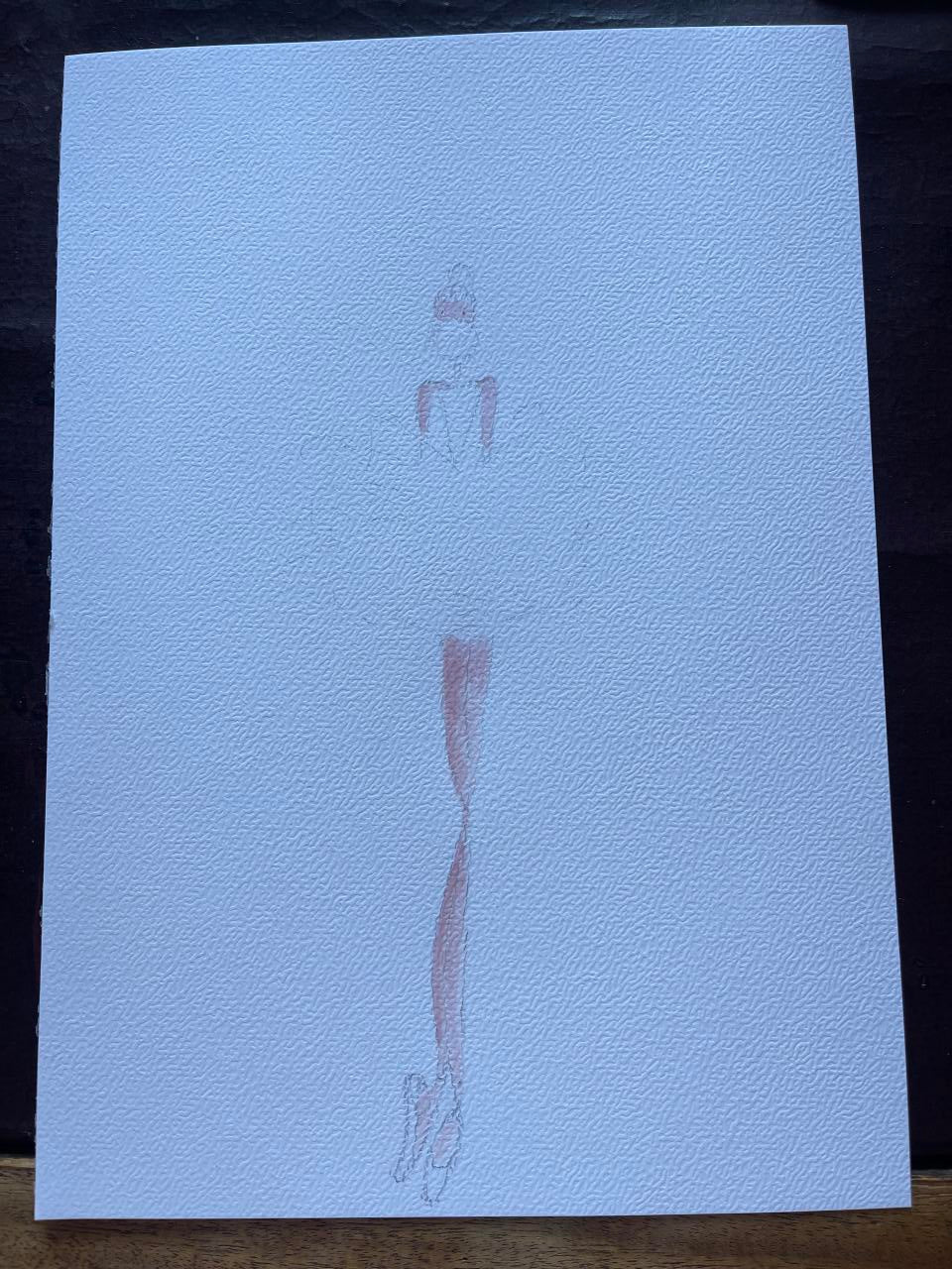 White paper with printed text and graphics on a dark background